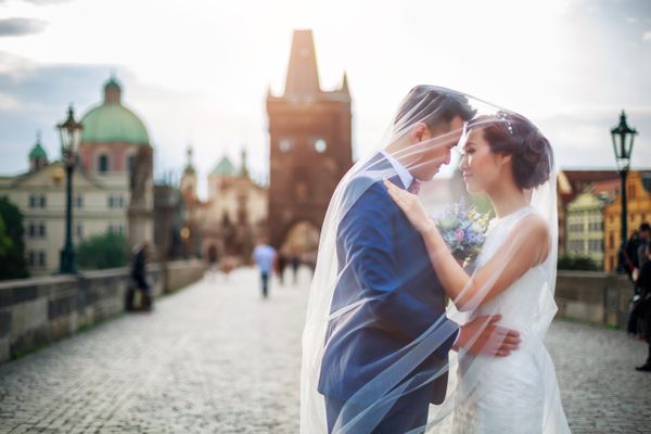 Groom and Bride on Charles Bridge in Prague